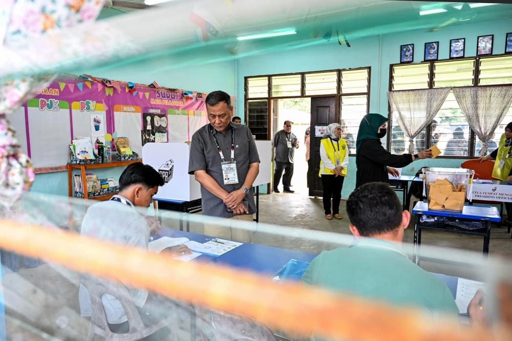 Rain fails to stop Sabah voters as turnout reaches 31.3pc by mid-morning, 85 centres shut at noon