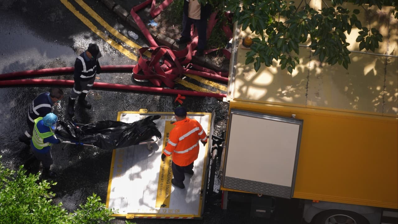 ‘She kept crying for me to rescue her’: victims’ families mourn fallen in Hong Kong